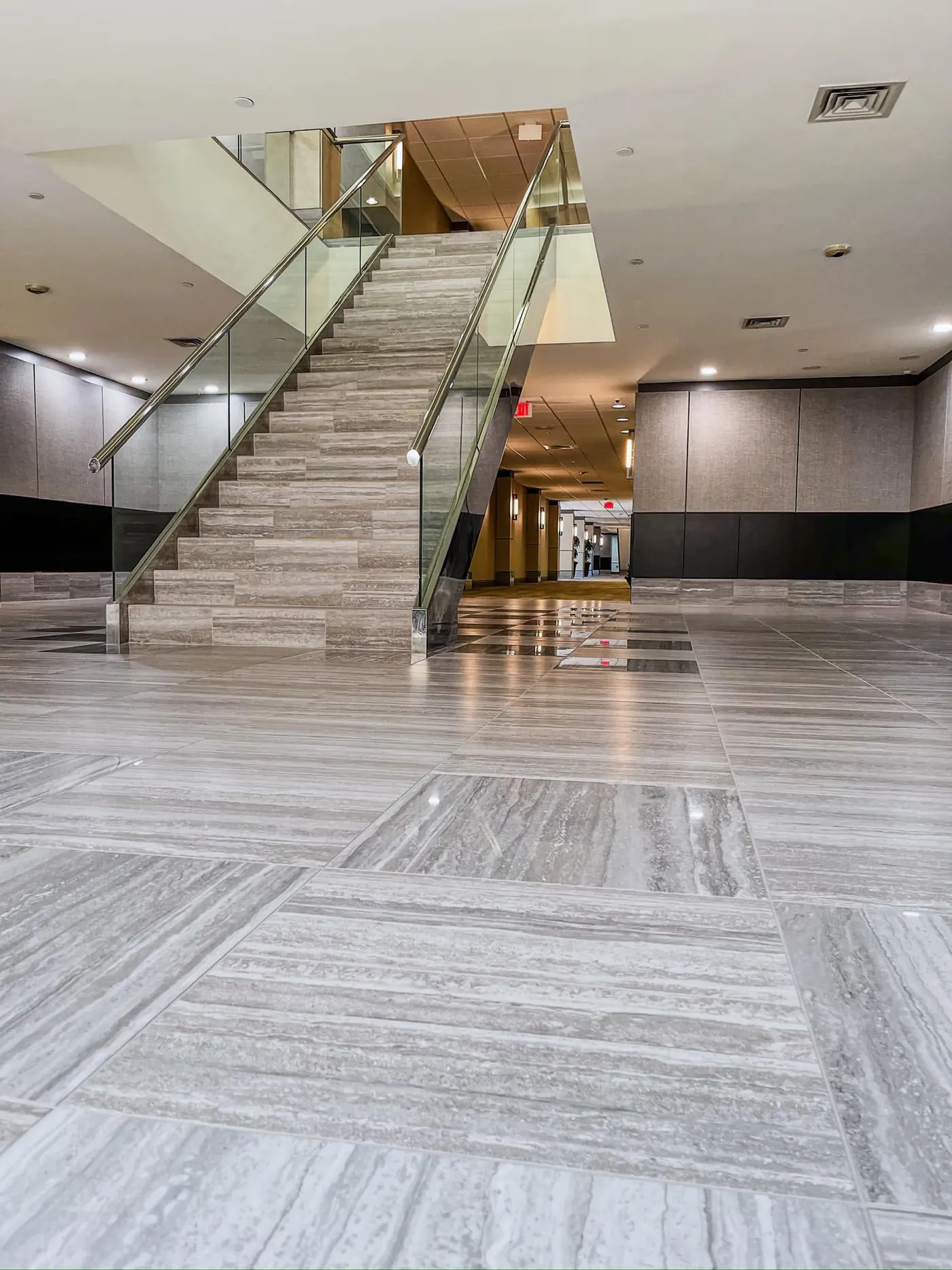 Commercial building lobby with polished stone-look floors